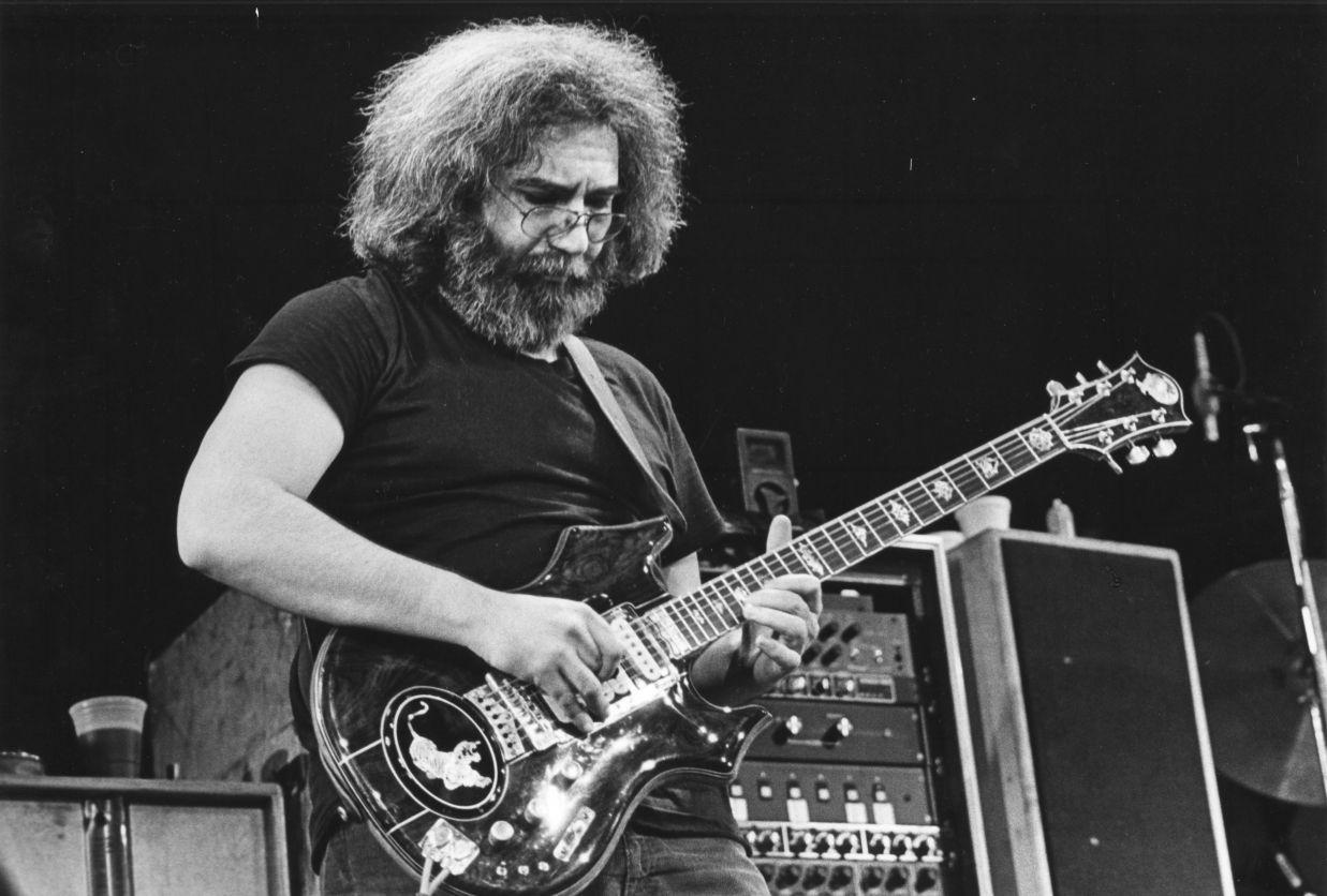 Jerry Garcia on stage playing guitar